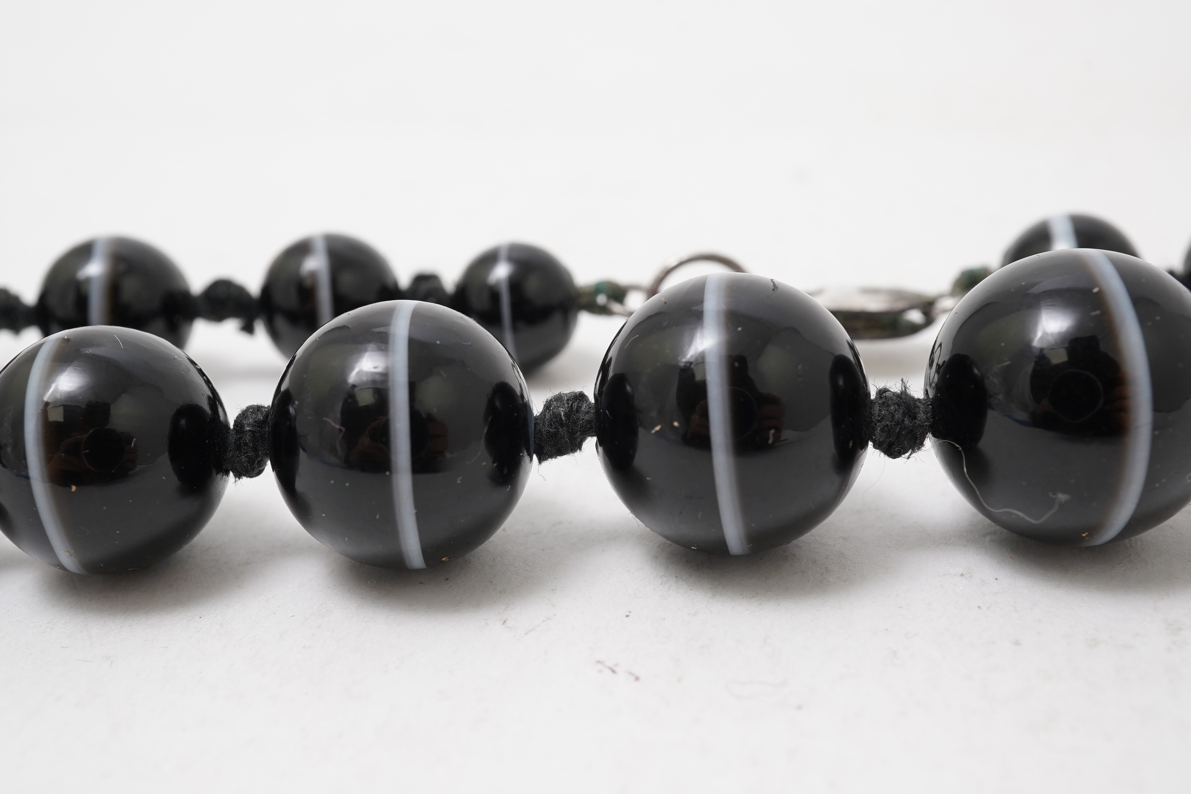 A banded onyx bead necklace, early 20th century